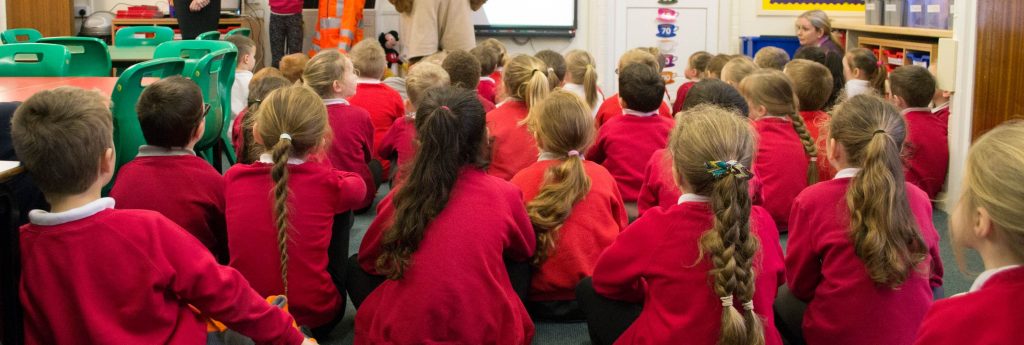 pupils sat in school watching gnaas presentation