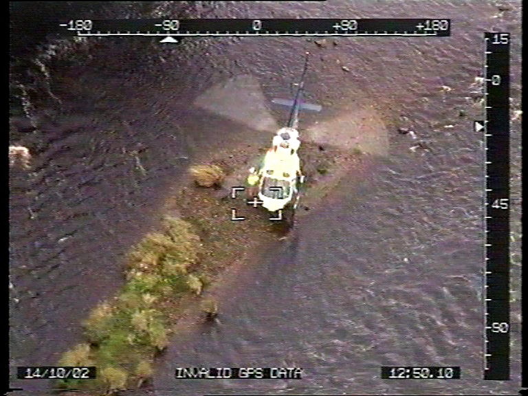 G-PASH helicopter landing on an island