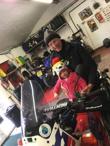 Ronnie Murray and his granddaughter Darcy on his bike