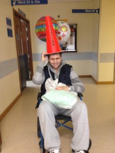 Kai Kristiansen with a cone on his head in hospital