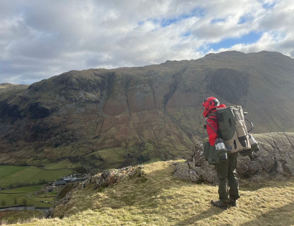 Jet suit paramedic at the summit of a mountain