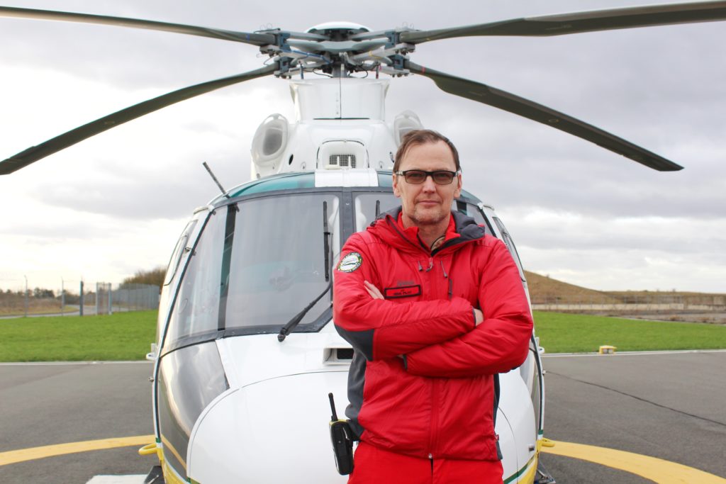 Pilot JJ stood in front of the Great North Air Ambulance